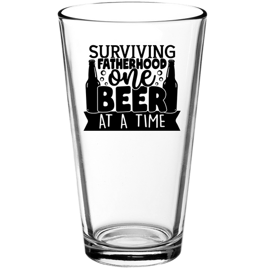 Surviving Fatherhood One Beer At a Time Funny Pint Glass - We Love Your Gift